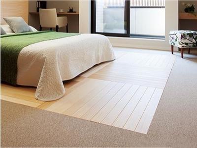 Flooring installer clicking luxury vinyl planks into place